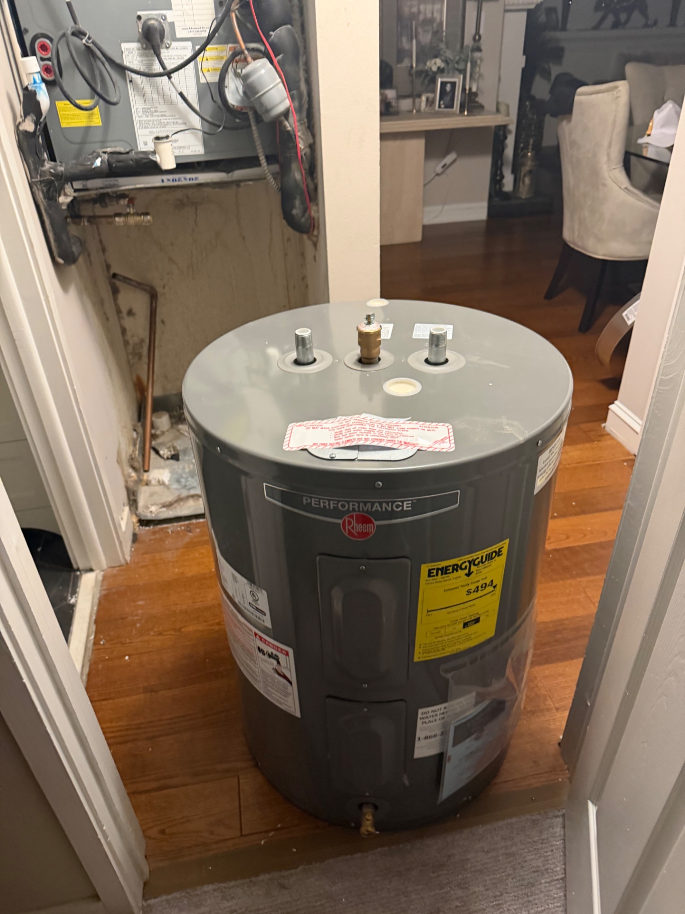 Newly installed Rheem Performance electric water heater ready for connection by BCS Plumbing